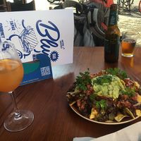 Homemade peach Kombucha, nacho’s and beer. Outside terrace with heating and blankets if needed    at Blu Bar in Barcelona