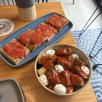 Pan Con Tomate top and Bravas at the bottom   at Blu Bar in Barcelona