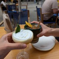Cocktail with passion fruit and coconut cream and a tikki-style spritz, with passion fruit, pineapple & lemon. at Blu Bar in Barcelona