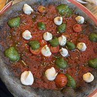 Pizza with pesto and chashew cheese at Blu Bar in Barcelona
