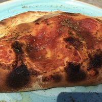 Calzone with homemade vegan ricotta, vegan smoked ham and mushrooms at Blu Bar in Barcelona