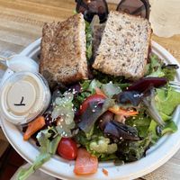 Special fancy hummus sandwich w side salad with tahini dressing on side  at Sugar Apple Organic Cafe in Key West