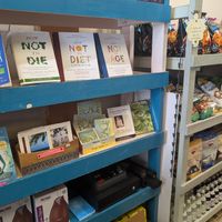 Dr. Gregor be out there saving our lives 💚🙌 WFPB books 💚 at Sugar Apple Organic Cafe in Key West