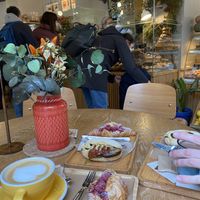 View from table. Vegan raspberry croissant and hummus sandwich  at Dulce de Leche - Boutique San Vicente in Valencia