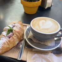 Vegan raspberry croissant and oat lattee  at Dulce de Leche - Boutique San Vicente in Valencia