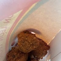 Close-up of takeaway Mac and cheese vegan bites at LEON - Norton Canes in Cannock