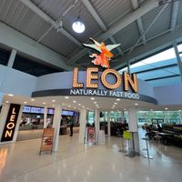 Interior, has seating area behind which is shared with another restaurant at LEON - Norton Canes in Cannock
