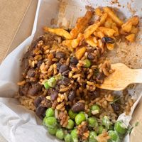 Brazilian black bean with side of fries & peas   at LEON - Pancras Square in North London