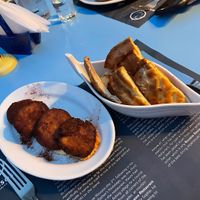Hummus with pitas (on the right) and something i dont remember the name 🙈 It was like falafel but more smooth.  at Roussos Restaurant in Corfu