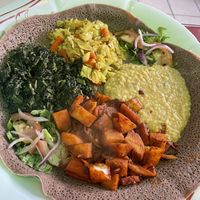 Full entree portions of Spicy Dinich Wot, Quosta, Tikil Gomen, and mild Ye Misir Wot  at Major Restaurant in Indianapolis