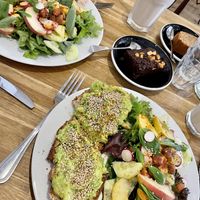 Avo toast with salad, humus toast with salad, brownie, orange cinnamon cake, smoothie of the day.  at Virgule in Toulouse