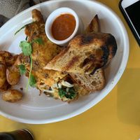 Just Egg omelette w/ impossible foods sausage, vegan cheese, winter veggies, and a spicy tomato sauce (ordered on the side). With wonderfully prepared fingerling potatoes & toast. at Wildseed in San Francisco