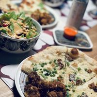 Carbonara pizza, curried cauliflower, and ensalada andalusia  at Wildseed in San Francisco