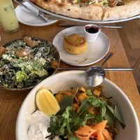 brunch pizza, biscuit, caesar salad, mezze bowl   at Wildseed in San Francisco