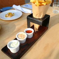 Belga fries with herb aioli, chipotle aioli, curry ketchup at Wildseed in San Francisco