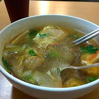Glass noodle soup with traditional Taiwanese red tea on the side. at SùShí GuǎngDōng Zhōu 素食廣東粥 in Kaohsiung