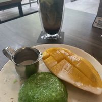 matcha latte with oat milk and espresso, and mango and pandan sticky rice  at The Coffee Club in Bangkok