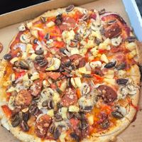 Vegetarian pizza made vegan and add vegan salami at Pluto's Pizza in Knoxfield