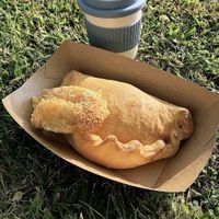 Calzone, small cheese pie and hot cappuccino! at OMG in SKG in Thessaloniki