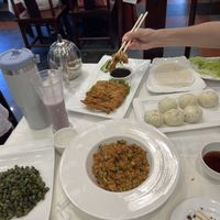 Fried green beans, fried soy sauce rice, vegan duck pancakes and steamed buns  at Gongdelin Vegetarian Restaurant in Beijing