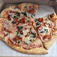 Large vegan pizza with roasted tomatoes and spinach (my husband already took a piece out)  at Mellow Mushroom in Branson