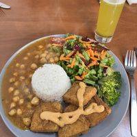 Nuggets de tofu com molho Prema, arroz de coco, estufado de abóbora com grão de bico e salada   at Prema in Viseu