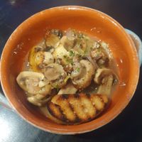 Starter: Garlic Mushrooms
- Fresh mushrooms tossed in garlic, olive oil and white wine, served with homemade focaccia bread at Giannis in Scarborough
