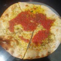 Starter: Garlic Pizza Tomato - Made with homemade pizza tomato sauce, garlic olive oil and a sprinkle of fresh basil at Giannis in Scarborough