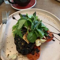 Vegan stack, partially drunk oat latte in background  at Beach House Cafe in Kaikoura
