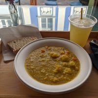 Daily stew: Indian Dahl with cauliflower, potato, carrots, delicious bread, lemon and lime drink at Oaza Joyful Kitchen in Zagreb