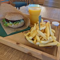 Sunny love burger, delicious fries, and the most amazing mango lassi at Oaza Joyful Kitchen in Zagreb