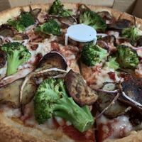 So many fantastic toppings available plus vegan cheeze! 🥦🍕🌱  at Mother Bear's - Campus in Bloomington