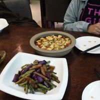 Braised aubergine with greens and home style tofu. at TiānLóng Bǎo Yán in Xian