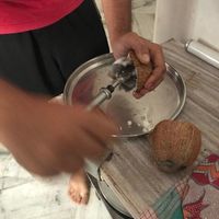 Being shown how to make coconut dip at AhimsaGram in Jaipur