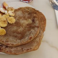 Brunch: Pancakes with peach, banana, syrup, and cinnamon. at Mela Canela in Sintra
