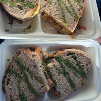 Hummus Toast and Tofu, Spinach, Sun Dried Tomato Toast (to go)   at Mela Canela in Sintra