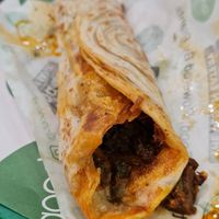 Chettinad Sukka Roll w/green chutney. Good but super oily at GoodDO - Bandra West in Mumbai