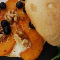 Mollete with cheese and peaches and walnuts at Malcafe in Conil De La Frontera