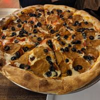 Pepperoni with olives at Rise Above Pizza & Wings in Hamilton