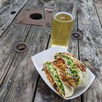 Buffalo crunch wrap with beer from brewery next door. at Toasty in Bend