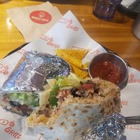 Huge and delicious portions. I tried but couldn't finish the vegan burrito. at Macho Grill in Jeju