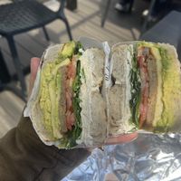 GF everything bagel, vegan egg and sausage, tofu cream cheese, tomato, spinach and avocado! Very tasty!!  at Bagel Point in Brooklyn