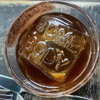 Cocktail with mezcal and great ice at Somebody People in Denver