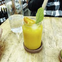 Orange juice, served with a bamboo straw  at FOOD Mercearia Biológica in Lisbon
