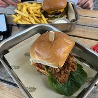 Fried chickens burger + spicy burger in the back   at Smokey Greens in Berlin