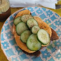 wholegrain bread with hummus cucumber and olive oil at Little Big House in Thessaloniki