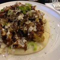 Cauliflower pizza with eggplant at EWR - Flora - TC in Newark