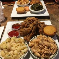 V fish (top) served with collard greens, “seafood” pasta and cornbread. V chick’n (bottom) served with maple syrup to dip, Mac and “cheese” and “seafood” pasta   at Go Vegan Philly in Wilmington