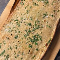 Gluten free sourdough garlic naan  at Uprising Bakehouse in Burlington