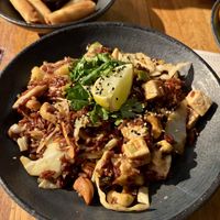 Brown rice (no egg option), tofu, shiitake, pineapple, cashews and veggies in sweet and sour sauce with a side of veg spring rolls  at Wok On in Copenhagen